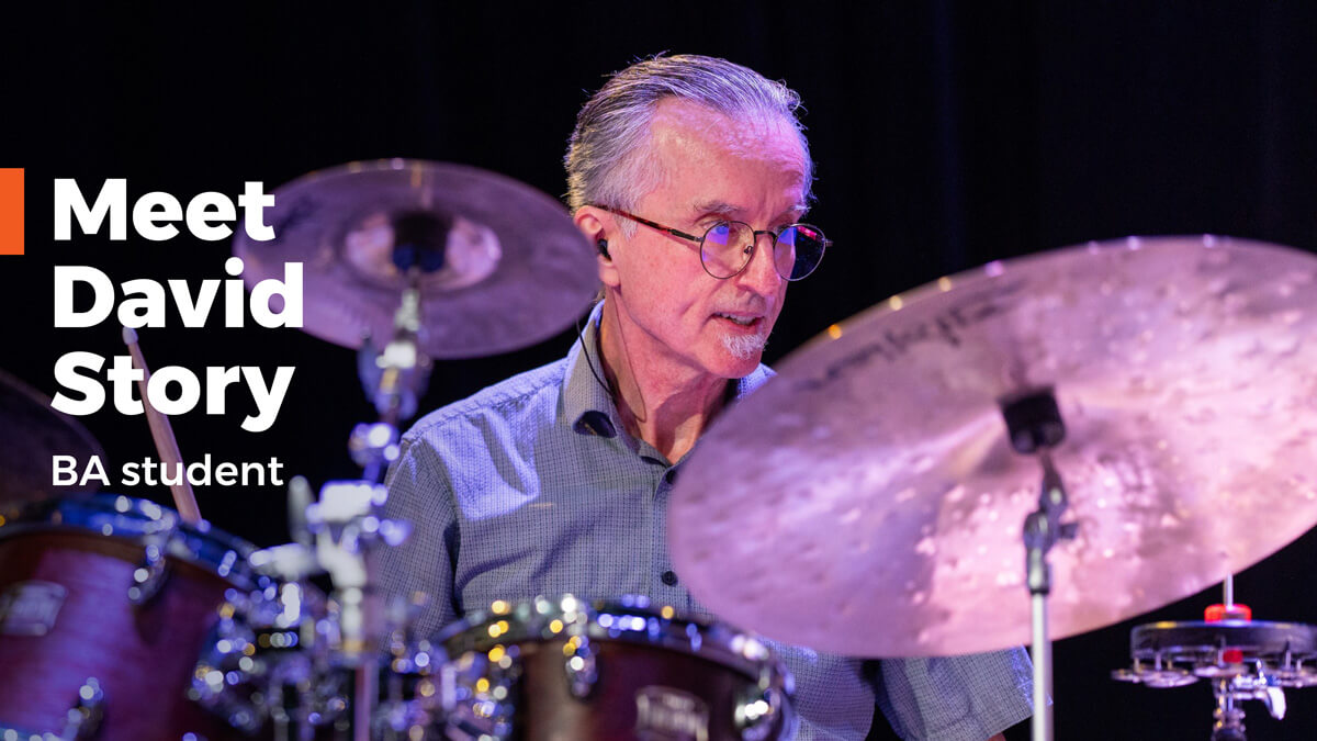 David Story sitting at a drum kit on stage